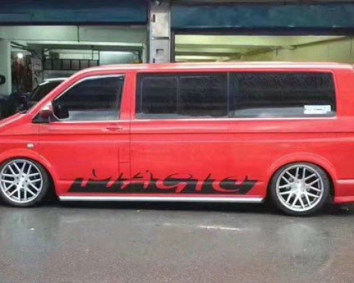 Fire red Volkswagen Multivan cambergang MPV low lying wind